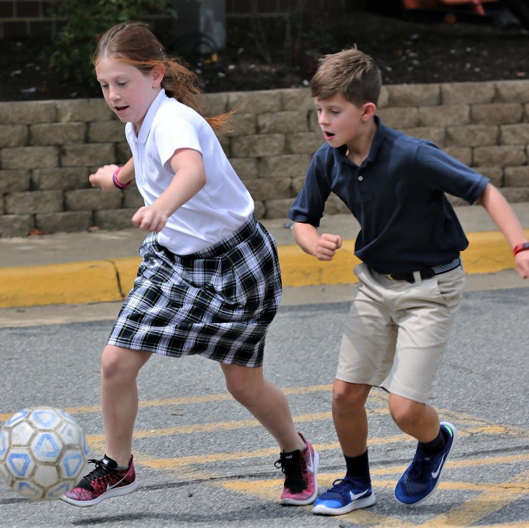 ICS students jump into a pick-up game of soccer during recess on the first day back to school