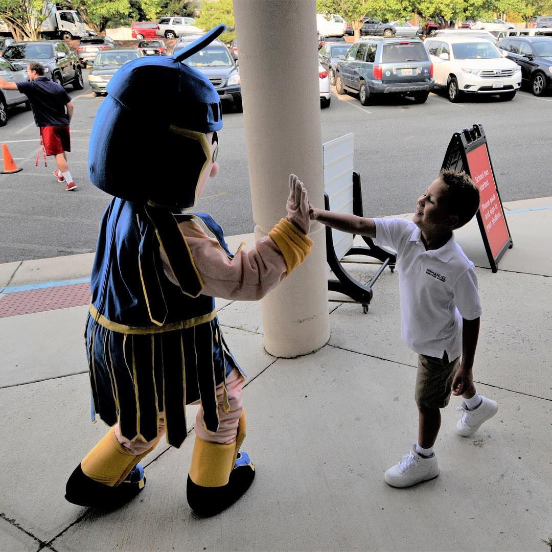 Wayne the Warrior greets ICS students on the first day of school