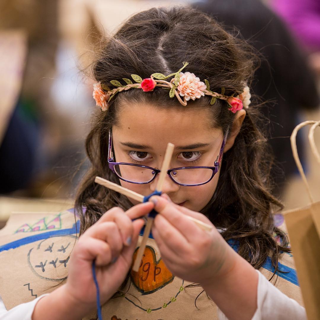 Concentration is the key as an third-grader completes a God’s Eye craft as a part of the Native American Festival on Monday afternoon